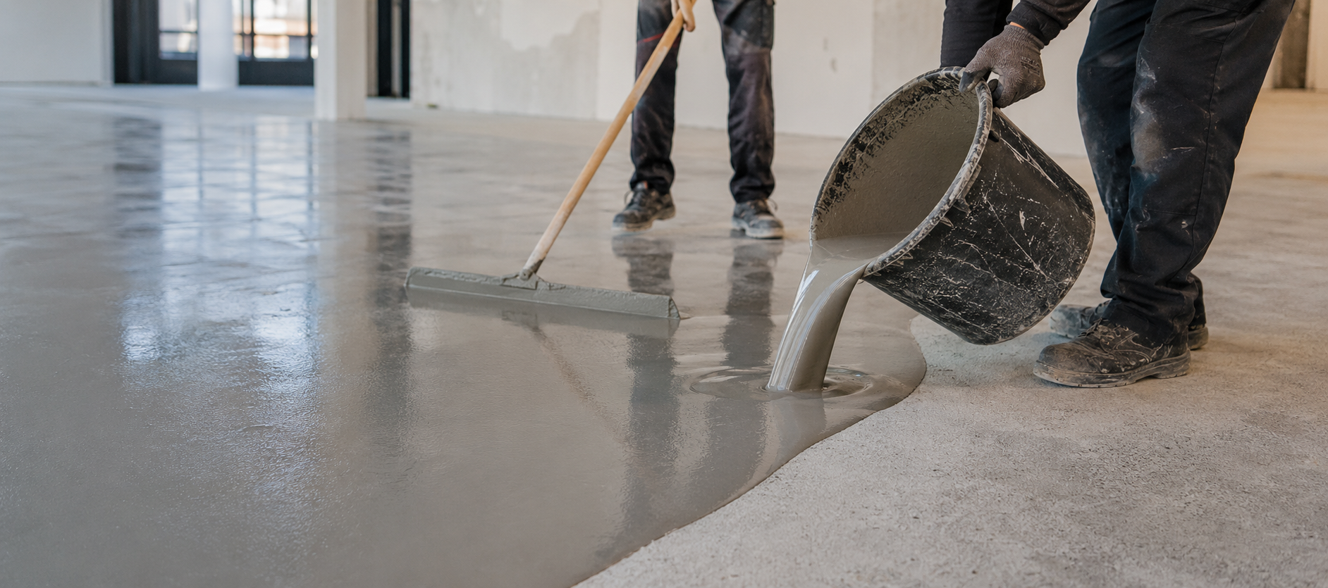 Self-leveling compound being spread on a floor